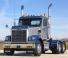 Freightliner 122SD 70 XT Mid Roof Cummins X15
