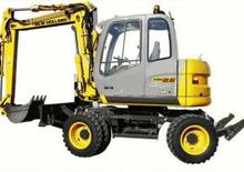 व्हील एक्सकेवेटर New Holland MH 2.6