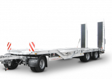 लोबेड ट्रेलर Schwarzmüller 3-axle low loader trailer with wheel recesses for transporting construction machinery